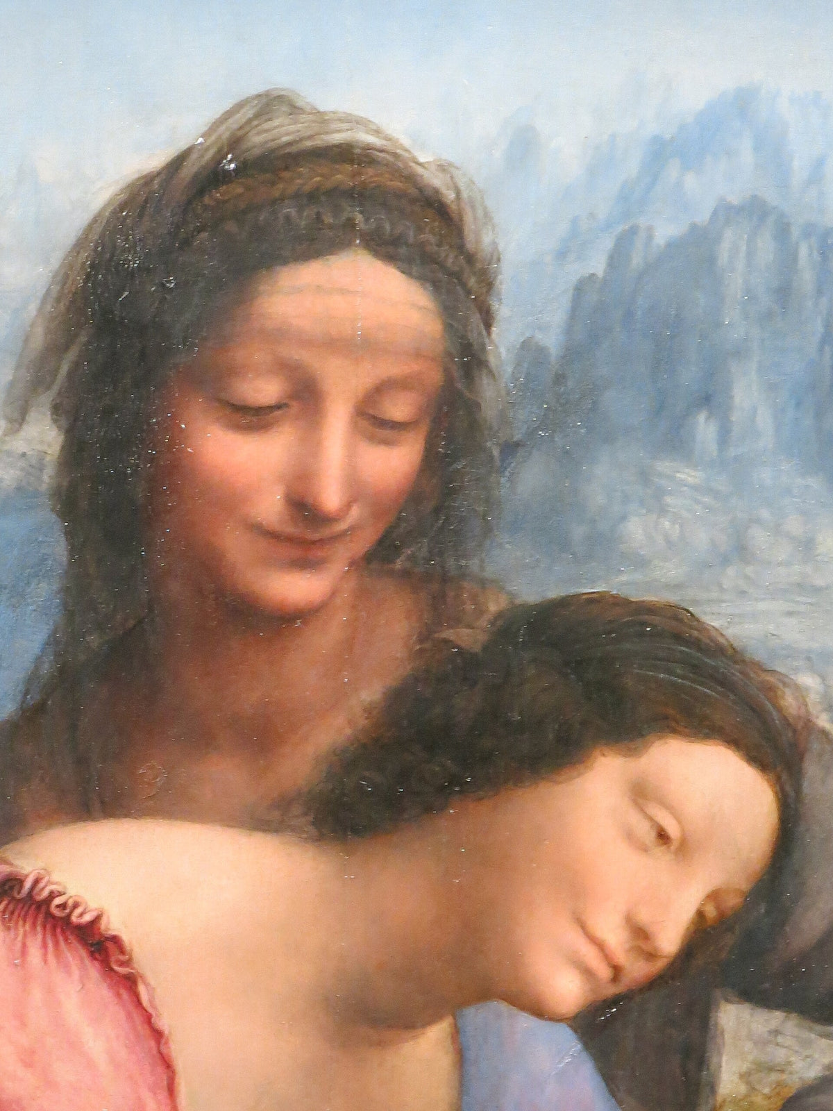 Détail des visages de sainte Anne et de la Vierge peintes par Léonard de Vinci