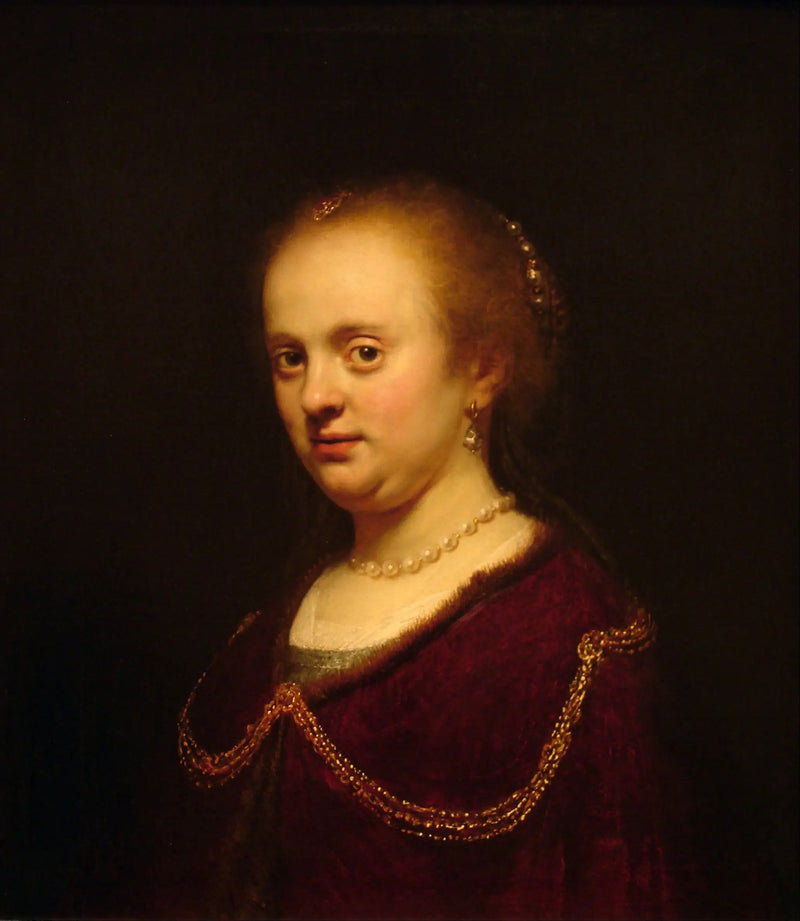 Nuori nainen kultaketjulla - Rembrandt
