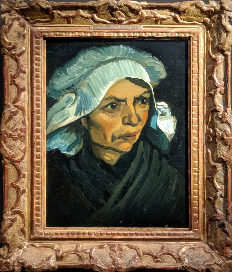 Maatilan naisen pää valkoisessa myssyssä - Vincent van Gogh