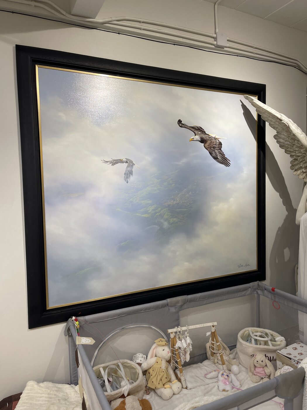 Flying eagles painting in a black frame